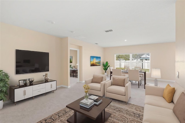 living area with visible vents, light colored carpet, and baseboards