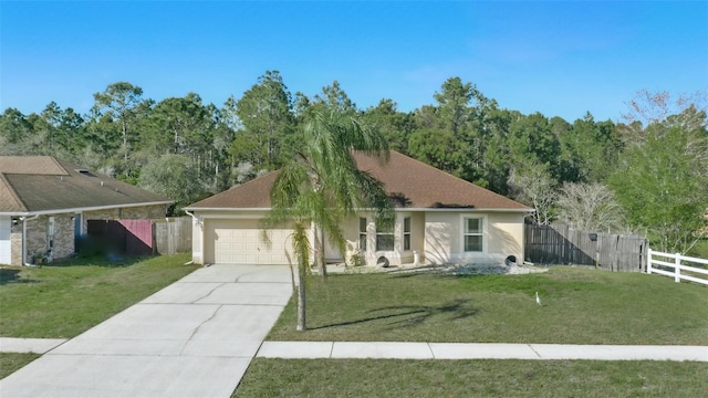 ranch-style house featuring stucco siding, driveway, a front lawn, and fence