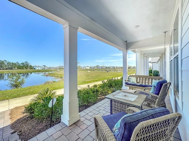 view of patio / terrace featuring a water view