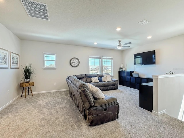 living room featuring visible vents, recessed lighting, baseboards, and carpet