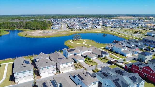 birds eye view of property featuring a residential view and a water view