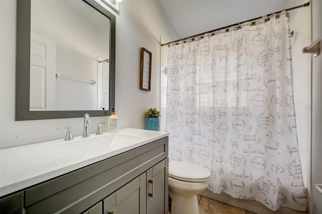 bathroom featuring toilet, shower / tub combo with curtain, and vanity