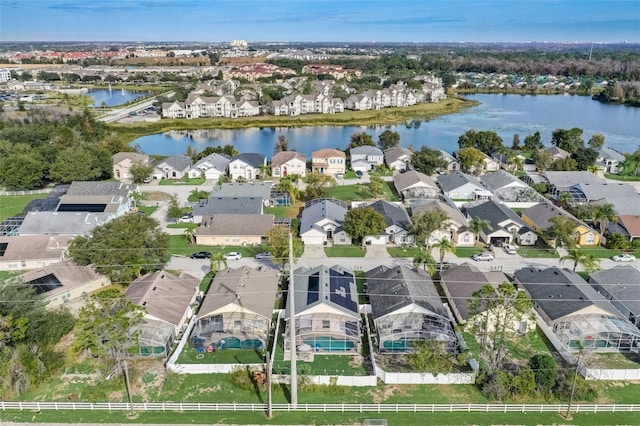 birds eye view of property with a residential view and a water view