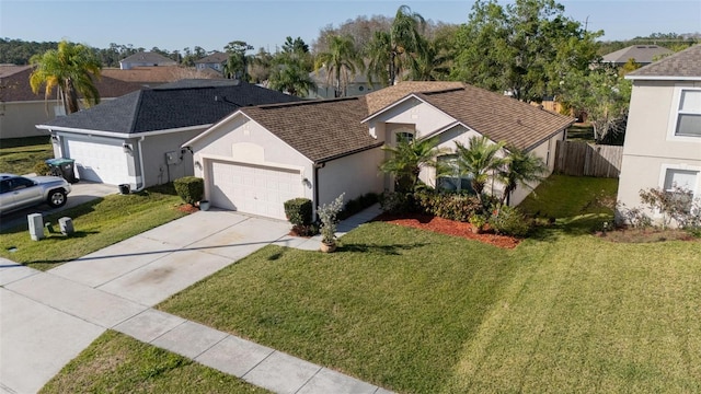 view of front of home featuring stucco siding, driveway, fence, an attached garage, and a front yard