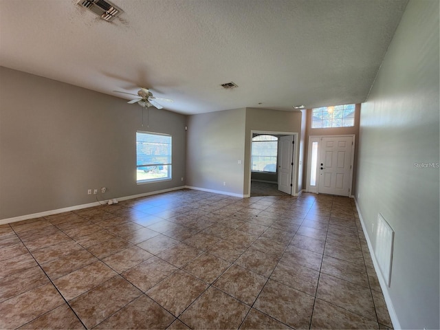 spare room with visible vents and a textured ceiling