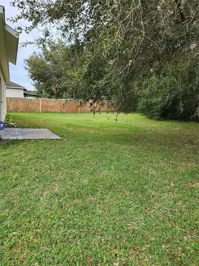 view of yard with fence