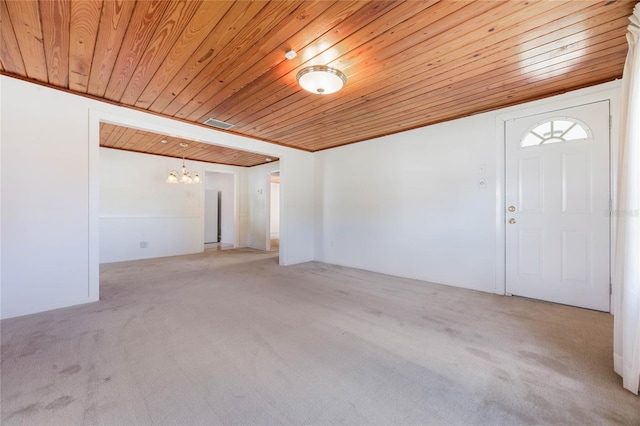 interior space with wood ceiling and an inviting chandelier