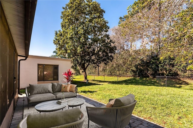 view of patio with outdoor lounge area and fence