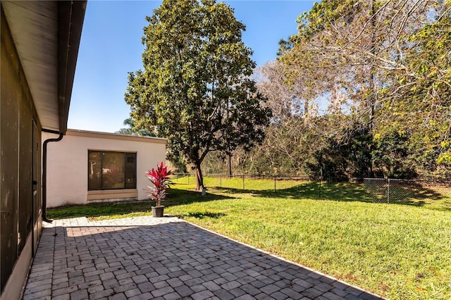 view of yard with a patio and fence