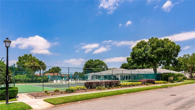 view of tennis court with fence