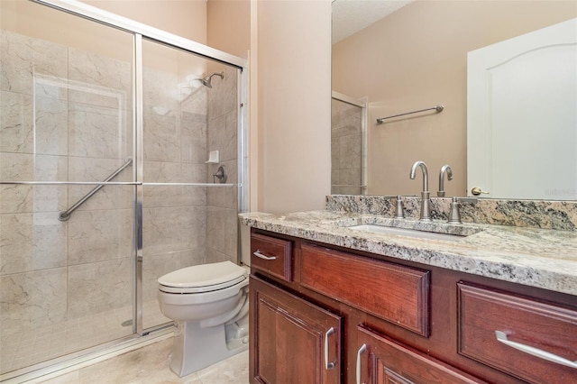 bathroom featuring tile patterned flooring, a stall shower, toilet, and vanity