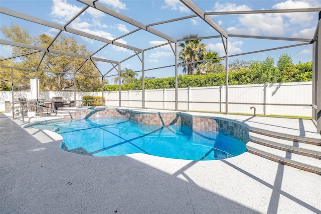 view of swimming pool featuring a jacuzzi, a patio, a fenced in pool, and fence