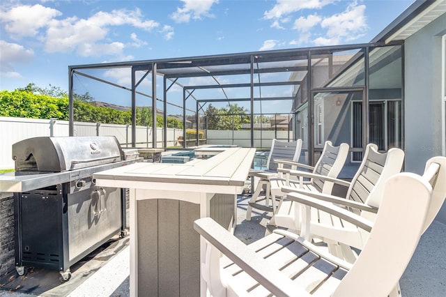 view of patio / terrace featuring glass enclosure, a fenced in pool, area for grilling, a fenced backyard, and a grill