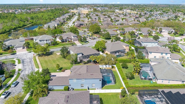 aerial view featuring a residential view and a water view