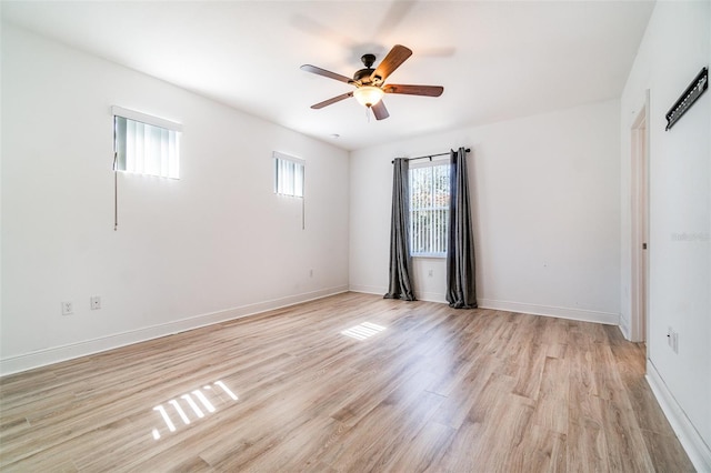 unfurnished room with light wood-style flooring, baseboards, and ceiling fan