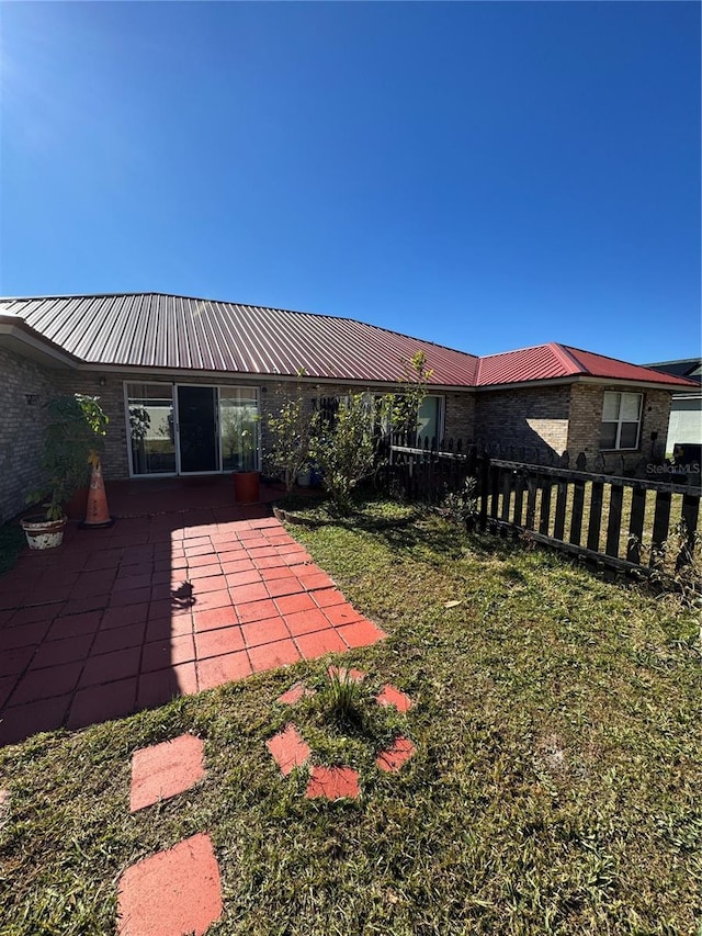 view of yard featuring a patio area and fence