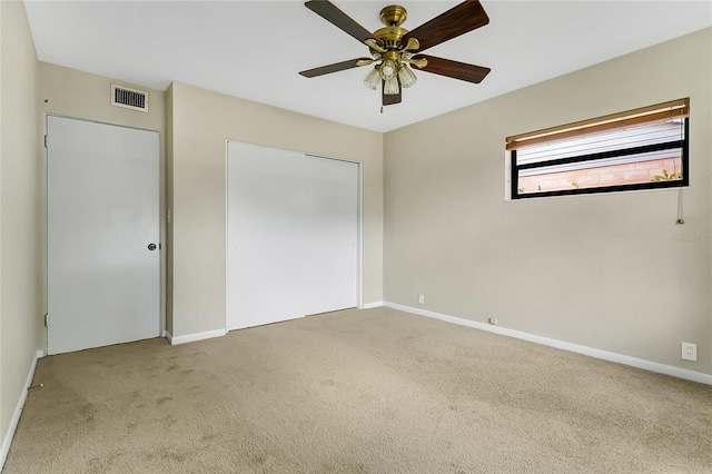 unfurnished bedroom featuring carpet, visible vents, and baseboards