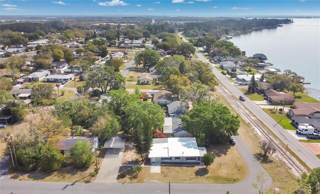 bird's eye view featuring a water view and a residential view