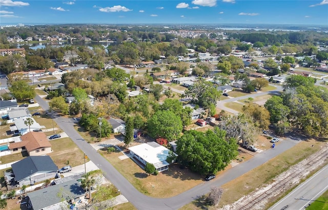 birds eye view of property with a residential view and a water view