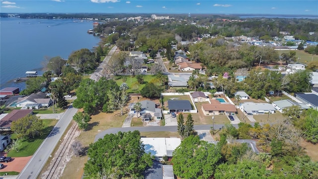 drone / aerial view featuring a residential view and a water view