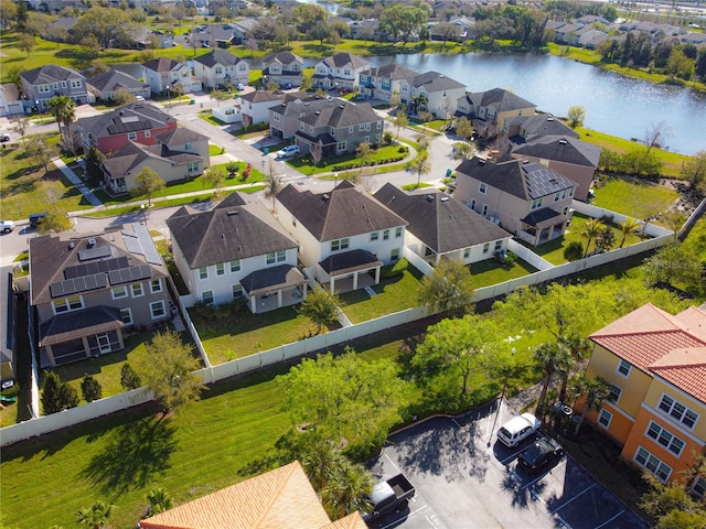 bird's eye view with a residential view and a water view