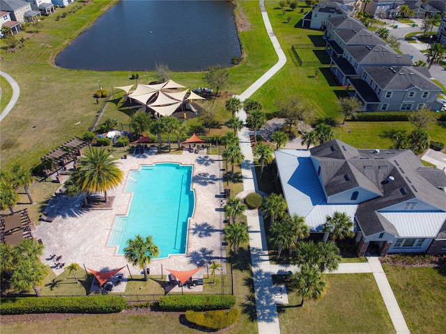 drone / aerial view with a residential view and a water view