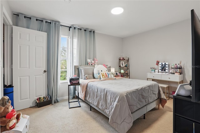 bedroom with light carpet