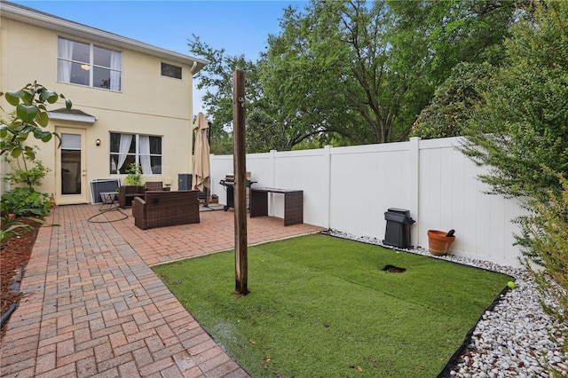 view of yard featuring a fenced backyard and a patio area