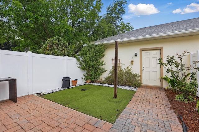 view of yard featuring a patio and fence