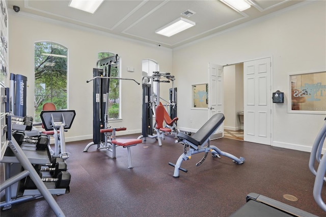 workout area featuring plenty of natural light and baseboards