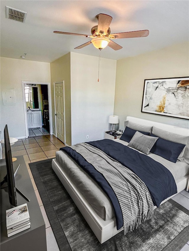 tiled bedroom featuring visible vents and ceiling fan