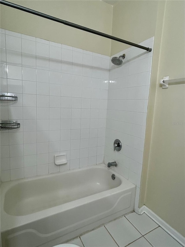 full bathroom with baseboards, shower / washtub combination, and tile patterned flooring