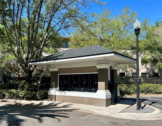 surrounding community with mail area and fence