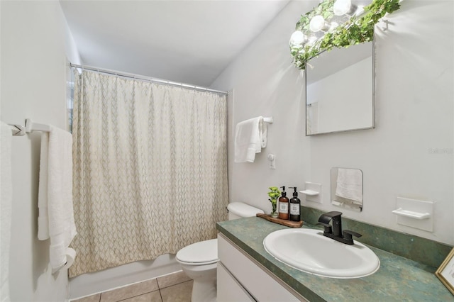 bathroom with tile patterned flooring, toilet, and vanity