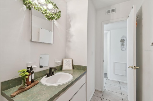 bathroom with tile patterned flooring, vanity, and visible vents