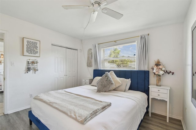 bedroom featuring a closet, ceiling fan, baseboards, and wood finished floors