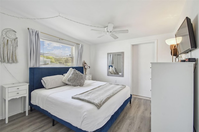 bedroom with light wood-style floors and ceiling fan