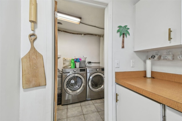 laundry area with light tile patterned floors, laundry area, and independent washer and dryer