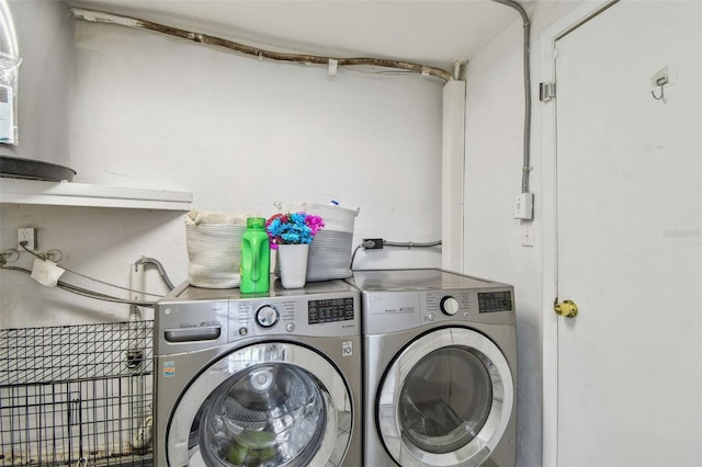 laundry room featuring washer and dryer and laundry area