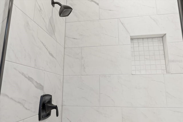 details with a tile shower