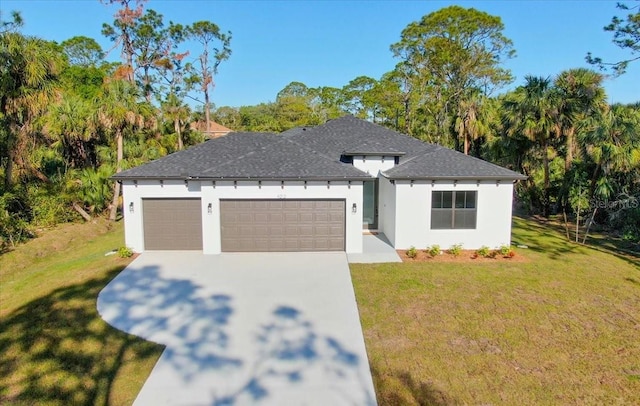 view of front of property featuring a shingled roof, a front lawn, stucco siding, a garage, and driveway