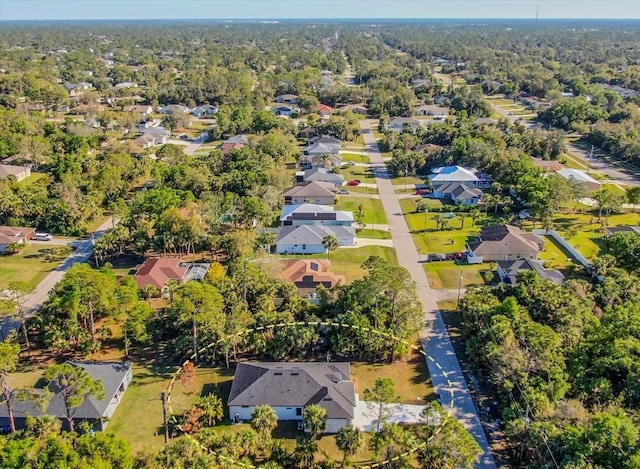 aerial view with a residential view and a view of trees