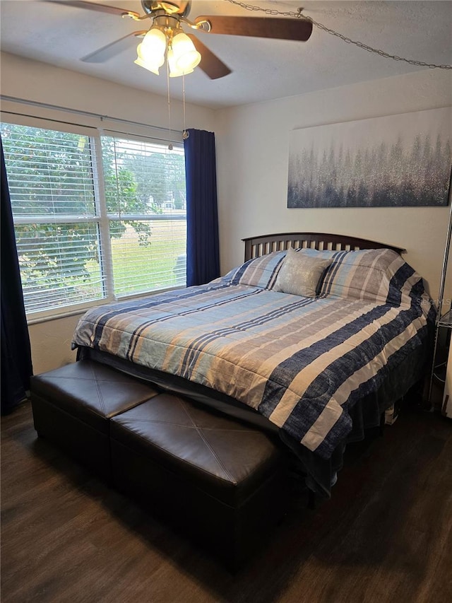 bedroom with ceiling fan and wood finished floors