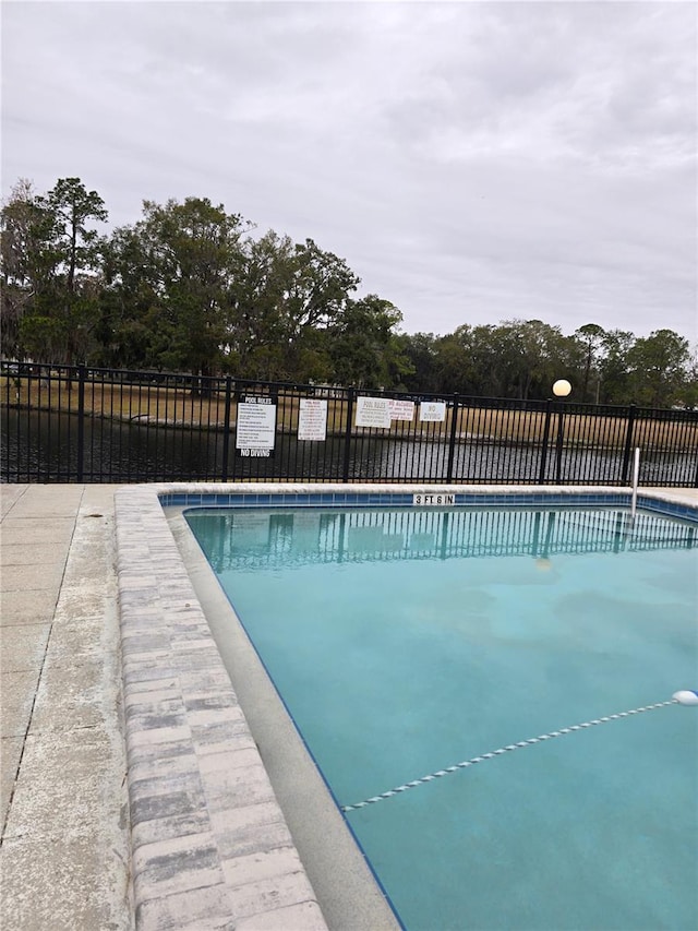 community pool with fence