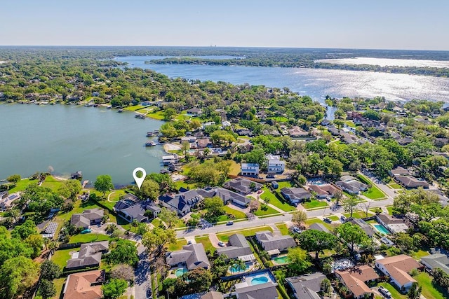 birds eye view of property with a water view and a residential view