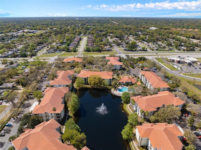 bird's eye view with a residential view and a water view