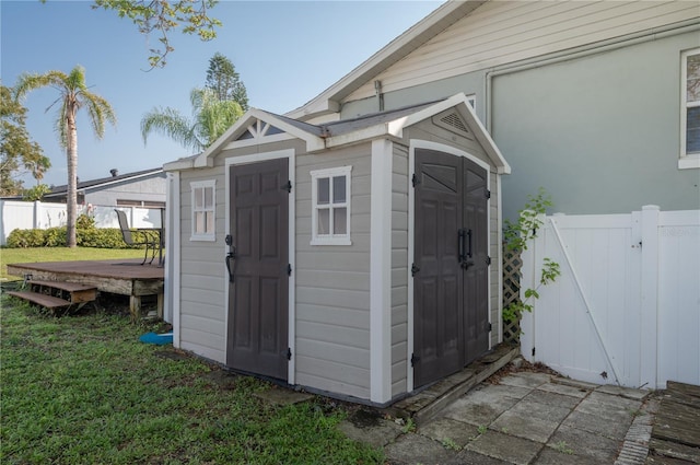 view of shed with a gate and fence