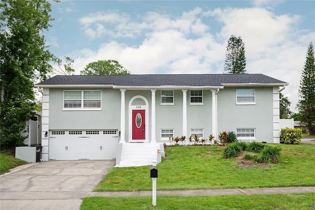 504 Teakwood Dr, Altamonte Springs, FL 32714 - bi-level home featuring a garage, stucco siding, a front yard, and driveway