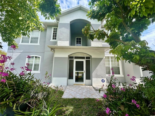 exterior space featuring stucco siding and a patio area