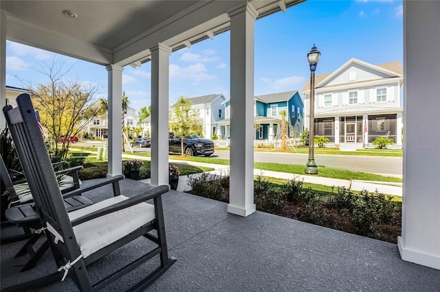 view of patio / terrace featuring a residential view and covered porch